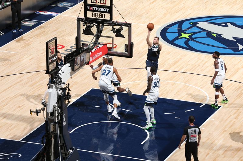 MINNEAPOLIS, MN -  OCTOBER 29: Luka Doncic #77 of the Dallas Mavericks shoots the ball during the game against the Minnesota Timberwolves on October 29, 2024 at Target Center in Minneapolis, Minnesota. NOTE TO USER: User expressly acknowledges and agrees that, by downloading and or using this Photograph, user is consenting to the terms and conditions of the Getty Images License Agreement. Mandatory Copyright Notice: Copyright 2024 NBAE (Photo by David Sherman/NBAE via Getty Images)