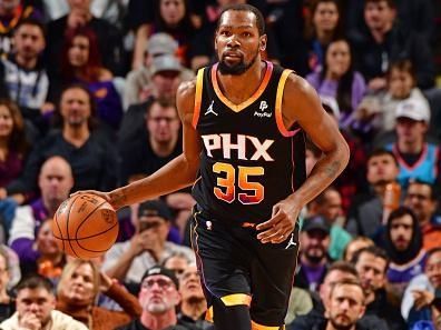 PHOENIX, AZ - DECEMBER 1: Kevin Durant #35 of the Phoenix Suns dribbles the ball during the game against the Denver Nuggets on December 1, 2023 at Footprint Center in Phoenix, Arizona. NOTE TO USER: User expressly acknowledges and agrees that, by downloading and or using this photograph, user is consenting to the terms and conditions of the Getty Images License Agreement. Mandatory Copyright Notice: Copyright 2023 NBAE (Photo by Barry Gossage/NBAE via Getty Images)