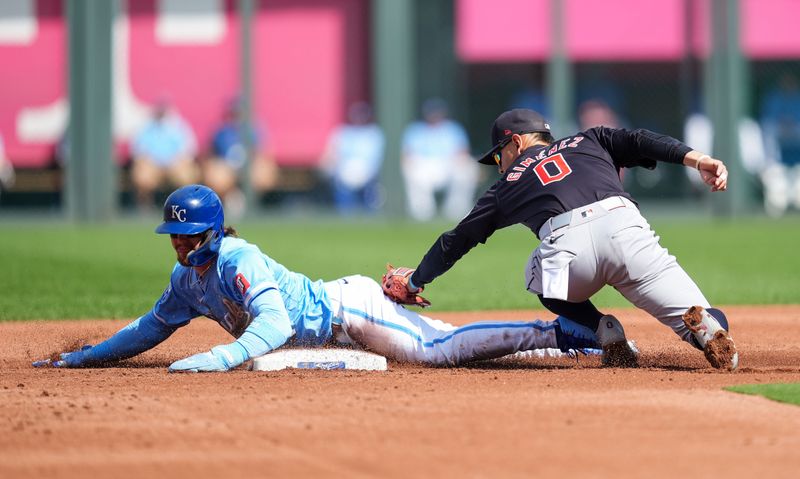 Sep 2, 2024; Kansas City, Missouri, USA; Kansas City Royals designated hitter Bobby Witt Jr. (7) steals second base against Cleveland Guardians second baseman Andres Gimenez (0) during the first inning at Kauffman Stadium. Mandatory Credit: Jay Biggerstaff-USA TODAY Sports