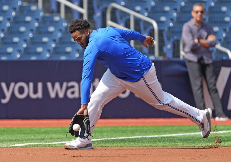 Sep 4, 2024; Toronto, Ontario, CAN; Toronto Blue Jays first baseman Vladimir Guerrero Jr. (27) fields balls at third base during batting practice before game against the Philadelphia Phillies at Rogers Centre. Mandatory Credit: Nick Turchiaro-Imagn Images