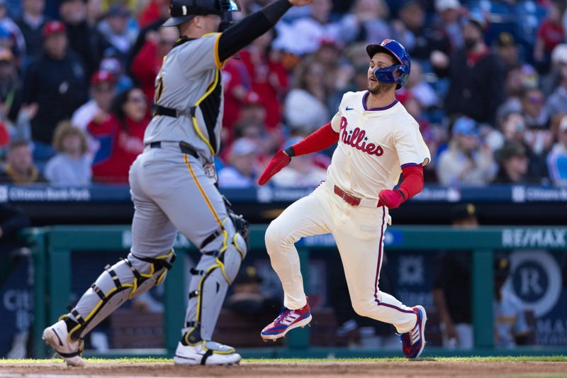 Apr 13, 2024; Philadelphia, Pennsylvania, USA; Philadelphia Phillies shortstop Trea Turner (7) scores in front of Pittsburgh Pirates catcher Henry Davis (32) during the first inning at Citizens Bank Park. Mandatory Credit: Bill Streicher-USA TODAY Sports