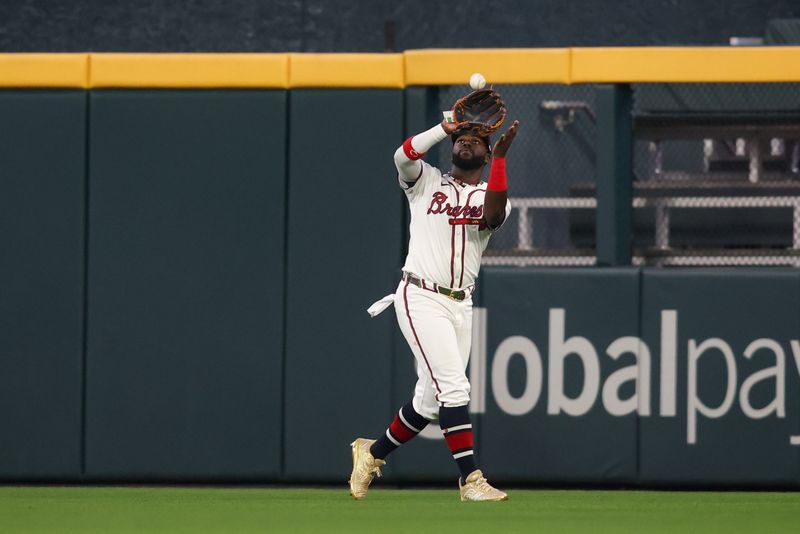 Apr 6, 2024; Atlanta, Georgia, USA; Atlanta Braves center fielder Michael Harris II (23) catches a fly ball against the Arizona Diamondbacks in the ninth inning at Truist Park. Mandatory Credit: Brett Davis-USA TODAY Sports
