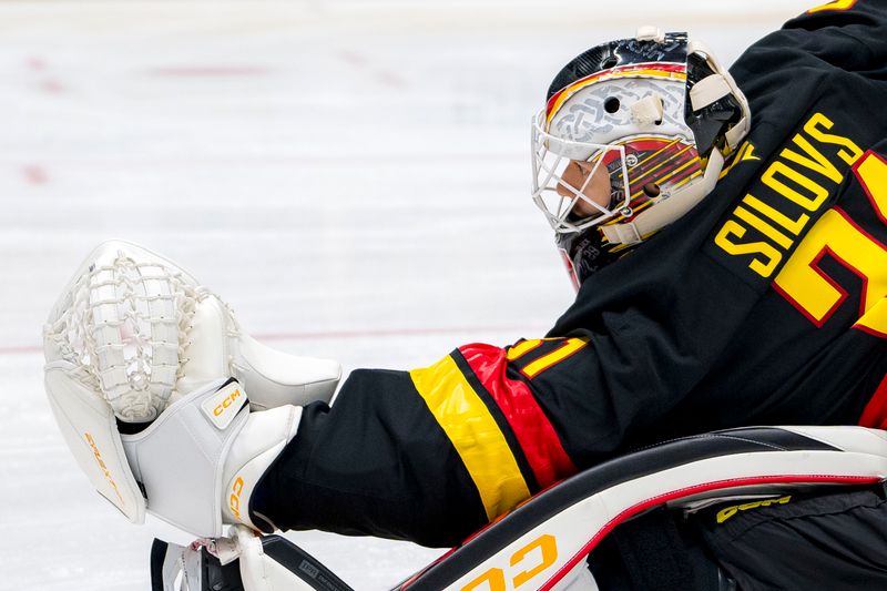 Nov 9, 2024; Vancouver, British Columbia, CAN; Vancouver Canucks goalie Arturs Silovs (31) stretches during warm up prior to a game against the Edmonton Oilers at Rogers Arena. Mandatory Credit: Bob Frid-Imagn Images