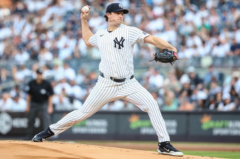 Jun 19, 2024; Bronx, New York, USA;  New York Yankees starting pitcher Gerrit Cole (45) pitches in the first inning against the Baltimore Orioles at Yankee Stadium. Mandatory Credit: Wendell Cruz-USA TODAY Sports