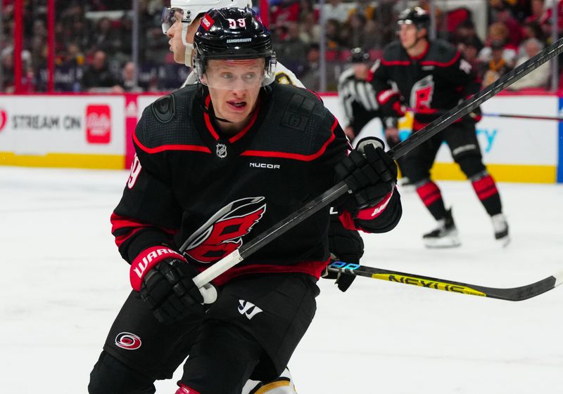 Apr 4, 2024; Raleigh, North Carolina, USA; Carolina Hurricanes left wing Jake Guentzel (59) skates against the Boston Bruins during the first period at PNC Arena. Mandatory Credit: James Guillory-USA TODAY Sports