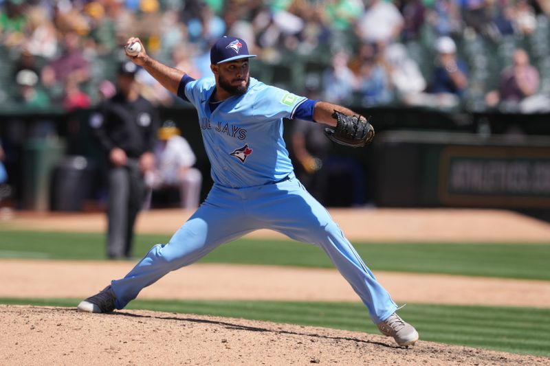 Jun 9, 2024; Oakland, California, USA; Toronto Blue Jays relief pitcher Yimi Garcia (93) throws a pitch against the Oakland Athletics during the ninth inning at Oakland-Alameda County Coliseum. Mandatory Credit: Darren Yamashita-USA TODAY Sports