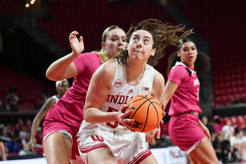 Jan 31, 2024; College Park, Maryland, USA; Indiana Hoosiers forward Mackenzie Holmes (54) look to shoot as Maryland Terrapins forward Allie Kubek (14) defends during the fist half  at Xfinity Center. Mandatory Credit: Tommy Gilligan-USA TODAY Sports