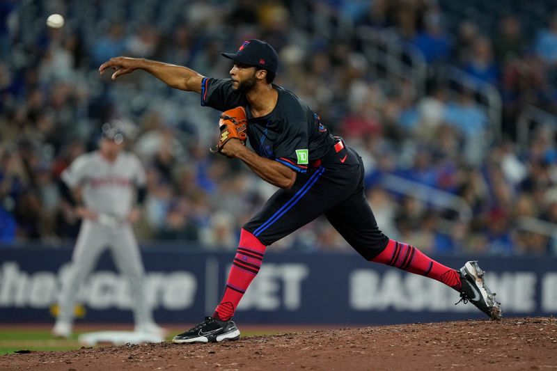 Sep 23, 2024; Toronto, Ontario, CAN; Toronto Blue Jays pitcher Trevor Richards (33) pitches to the Boston Red Sox during the eighth inning at Rogers Centre. Mandatory Credit: John E. Sokolowski-Imagn Images