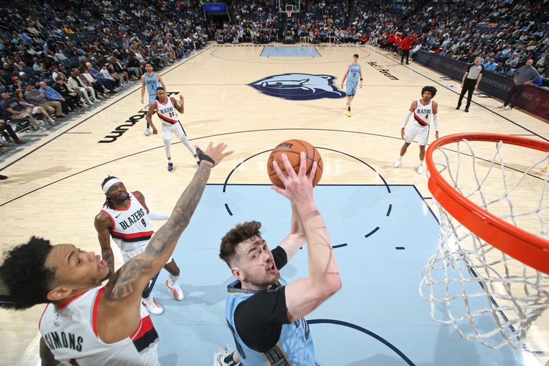 MEMPHIS, TN - MARCH 2: Matt Hurt #20 of the Memphis Grizzlies shoots the ball during the game against the Portland Trail Blazers on March 2, 2024 at FedExForum in Memphis, Tennessee. NOTE TO USER: User expressly acknowledges and agrees that, by downloading and or using this photograph, User is consenting to the terms and conditions of the Getty Images License Agreement. Mandatory Copyright Notice: Copyright 2024 NBAE (Photo by Joe Murphy/NBAE via Getty Images)