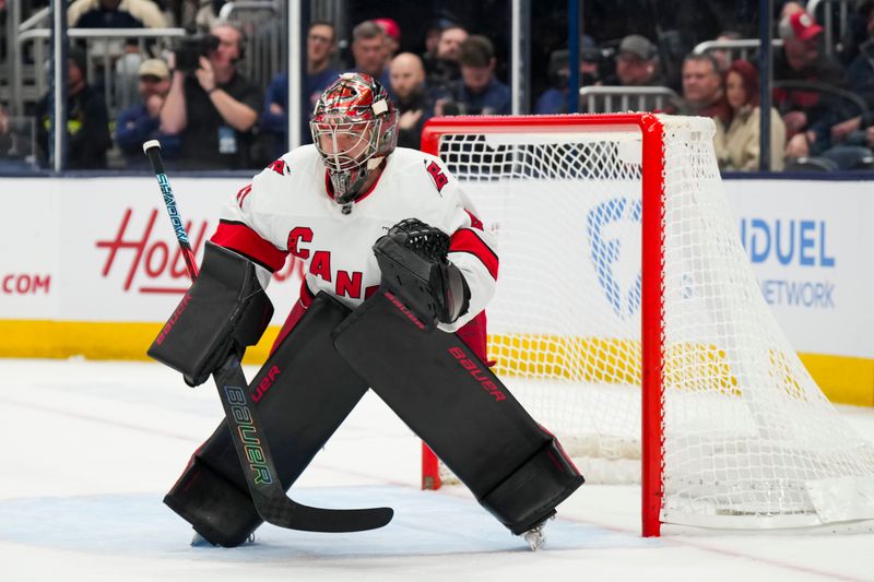 Nov 23, 2024; Columbus, Ohio, USA;  Carolina Hurricanes goaltender Spencer Martin (41) defends the net against the Columbus Blue Jackets in the overtime period at Nationwide Arena. Mandatory Credit: Aaron Doster-Imagn Images