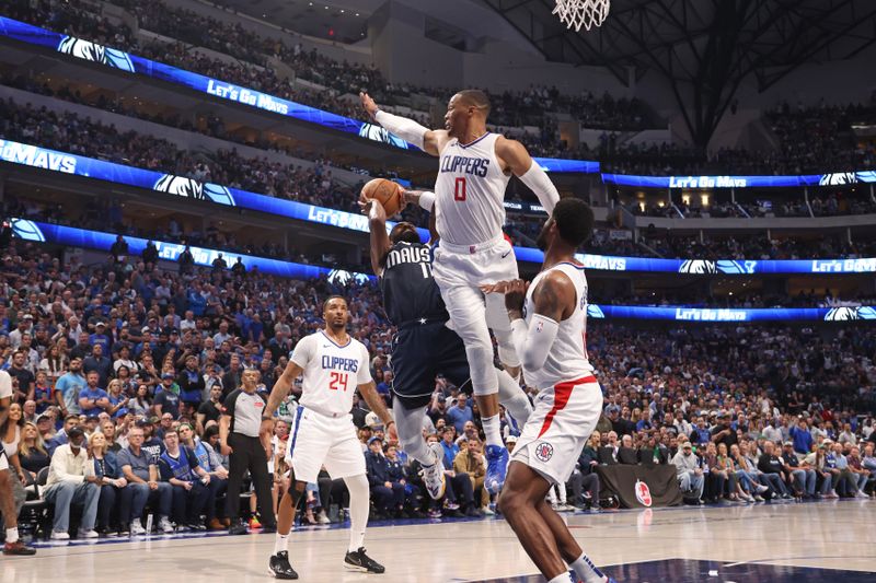 DALLAS, TX - APRIL 28: Kyrie Irving #11 of the Dallas Mavericks shoots the ball during the game against the LA Clippers during Round 1 Game 4 of the 2024 NBA Playoffs on April 28, 2024 at the American Airlines Center in Dallas, Texas. NOTE TO USER: User expressly acknowledges and agrees that, by downloading and or using this photograph, User is consenting to the terms and conditions of the Getty Images License Agreement. Mandatory Copyright Notice: Copyright 2024 NBAE (Photo by Tim Heitman/NBAE via Getty Images)