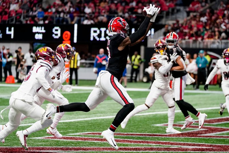 Atlanta Falcons tight end Kyle Pitts (8) makes the catch for a touchdown in the end zone against the Washington Commanders during the first half of an NFL football game, Sunday, Oct. 15, 2023, in Atlanta. (AP Photo/John Bazemore)