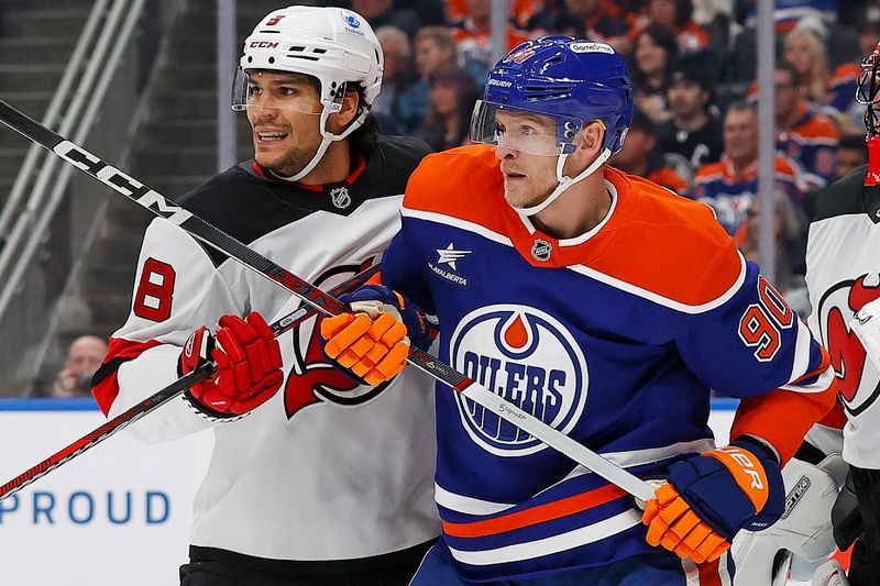 Nov 4, 2024; Edmonton, Alberta, CAN; Edmonton Oilers forward Corey Perry (90) battles with New Jersey Devils defensemen John Kovacevic (8) during the third period at Rogers Place. Mandatory Credit: Perry Nelson-Imagn Images