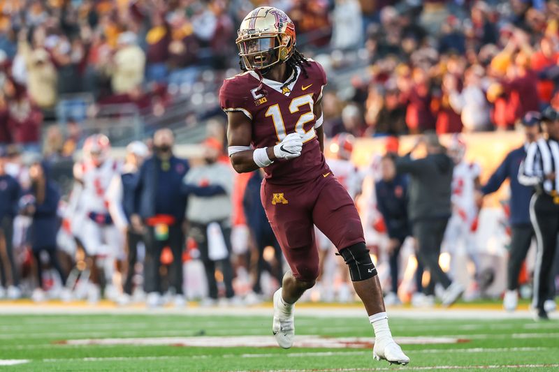 Nov 4, 2023; Minneapolis, Minnesota, USA; Minnesota Golden Gophers defensive back Darius Green (12) celebrates a fumble recovery against the Illinois Fighting Illini during the second half at Huntington Bank Stadium. Mandatory Credit: Matt Krohn-USA TODAY Sports