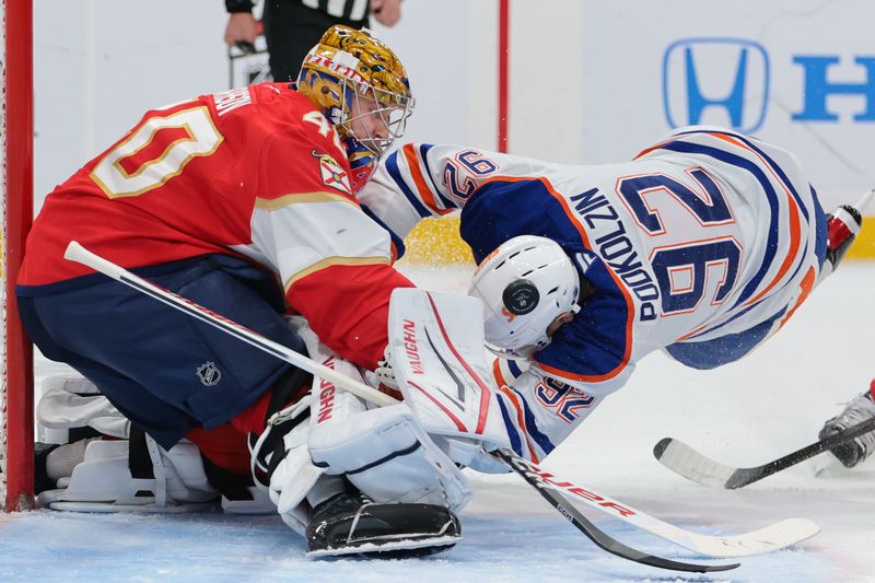 Nov 22, 2025; Sunrise, Florida, USA; Florida Panthers goaltender Daniil Tarasov (40) makes a save against Edmonton Oilers right wing Vasily Podkolzin (92) during the second period at Amerant Bank Arena. Mandatory Credit: Sam Navarro-Imagn Images