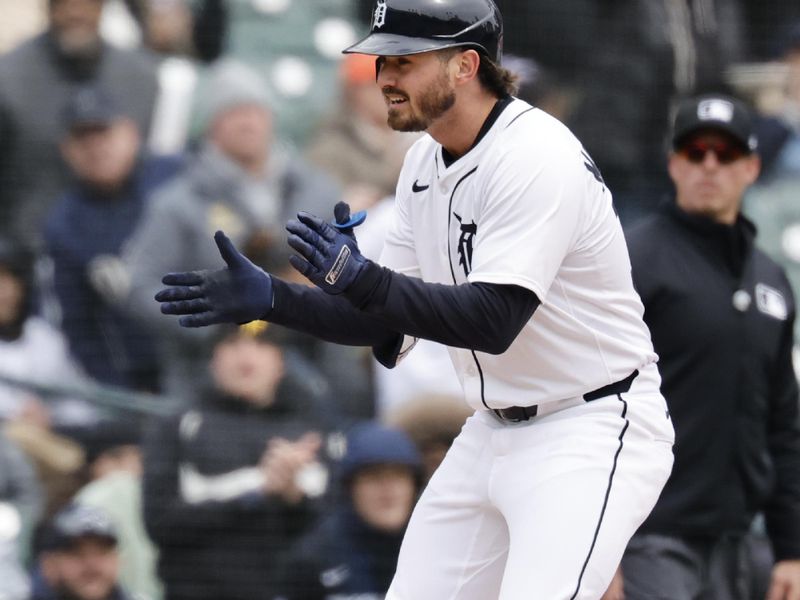 Apr 9, 2025; Detroit, Michigan, USA;  Detroit Tigers shortstop Zach McKinstry (39) celebrates after he hits a triple in the fifth inning against the New York Yankees at Comerica Park. Mandatory Credit: Rick Osentoski-Imagn Images