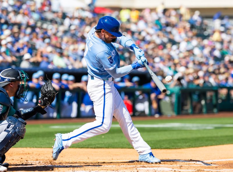 Feb 25, 2026; Surprise, Arizona, USA; Kansas City Royals shortstop Bobby Witt Jr. hits a double against the Seattle Mariners during a spring training game at Surprise Stadium. Mandatory Credit: Mark J. Rebilas-Imagn Images