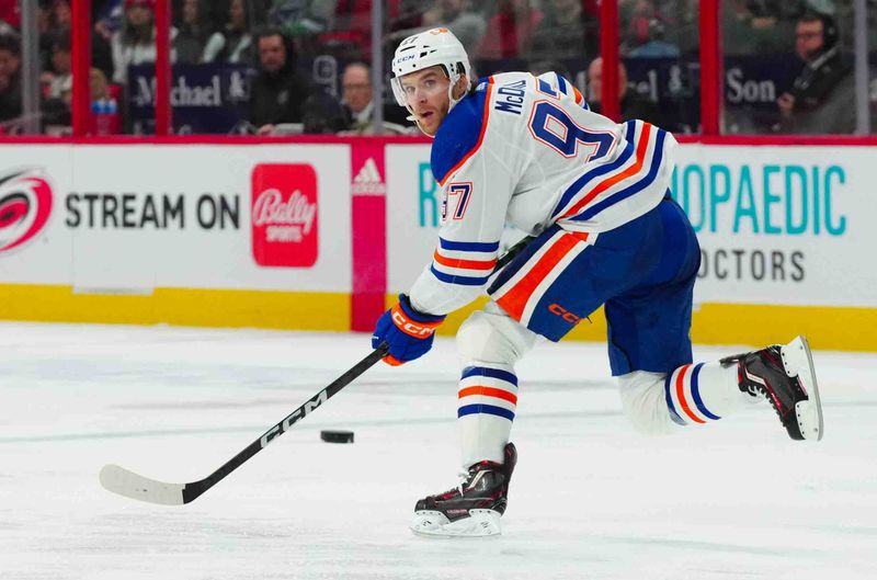 Nov 22, 2023; Raleigh, North Carolina, USA; Edmonton Oilers center Connor McDavid (97) waits for the pass against the Carolina Hurricanes during the third period at PNC Arena. Mandatory Credit: James Guillory-USA TODAY Sports