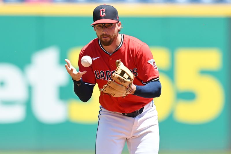 Jun 29, 2025; Cleveland, Ohio, USA; Cleveland Guardians shortstop Daniel Schneemann (10) bobbles a hit by St. Louis Cardinals third baseman Nolan Arenado (not pictured) during the third inning at Progressive Field. Mandatory Credit: Ken Blaze-Imagn Images