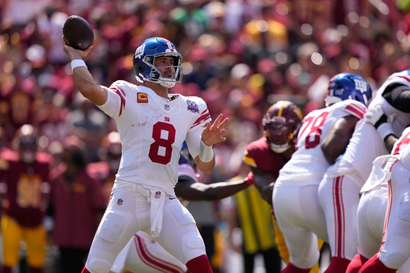 New York Giants quarterback Daniel Jones (8) looks to pass against the Washington Commanders during the first half of an NFL football game in Landover, Md., Sunday, Sept. 15, 2024. (AP Photo/Matt Slocum)