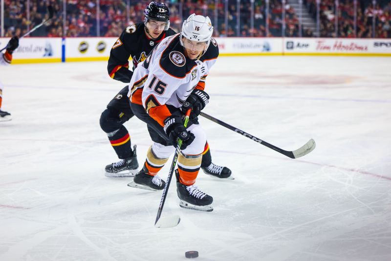 Apr 2, 2024; Calgary, Alberta, CAN; Anaheim Ducks center Ryan Strome (16) controls the puck against Calgary Flames center Yegor Sharangovich (17) during the first period at Scotiabank Saddledome. Mandatory Credit: Sergei Belski-USA TODAY Sports