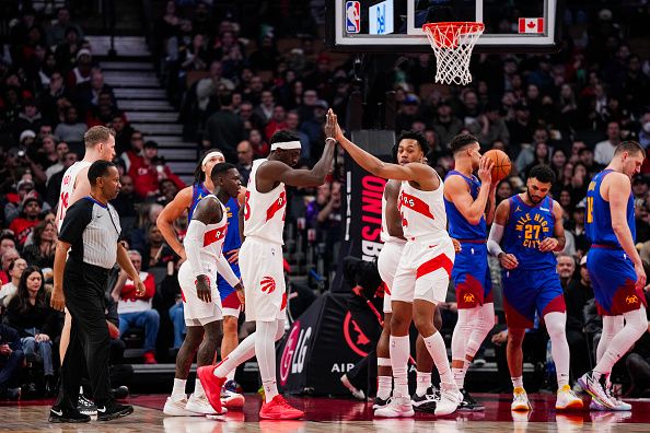 TORONTO, ON - DECEMBER 20: Pascal Siakam #43 of the Toronto Raptors celebrates a basket with teammate Scottie Barnes #4 during the first half agianst the Denver Nuggets at Scotiabank Arena on December 20, 2023 in Toronto, Ontario, Canada. NOTE TO USER: User expressly acknowledges and agrees that, by downloading and/or using this Photograph, user is consenting to the terms and conditions of the Getty Images License Agreement. (Photo by Andrew Lahodynskyj/Getty Images)