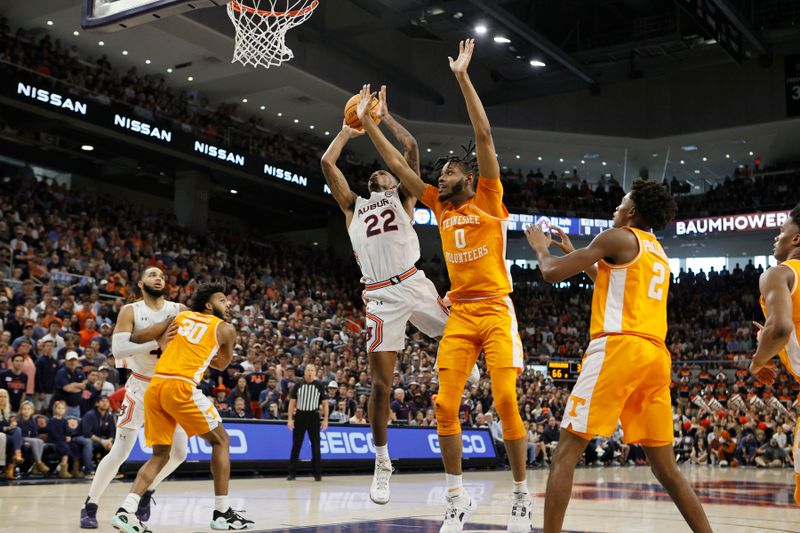 Mar 4, 2023; Auburn, Alabama, USA;  Auburn Tigers guard Allen Flanigan (22) shoots the ball against Tennessee Volunteers forward Jonas Aidoo (0) during the second half at Neville Arena. Mandatory Credit: John Reed-USA TODAY Sports