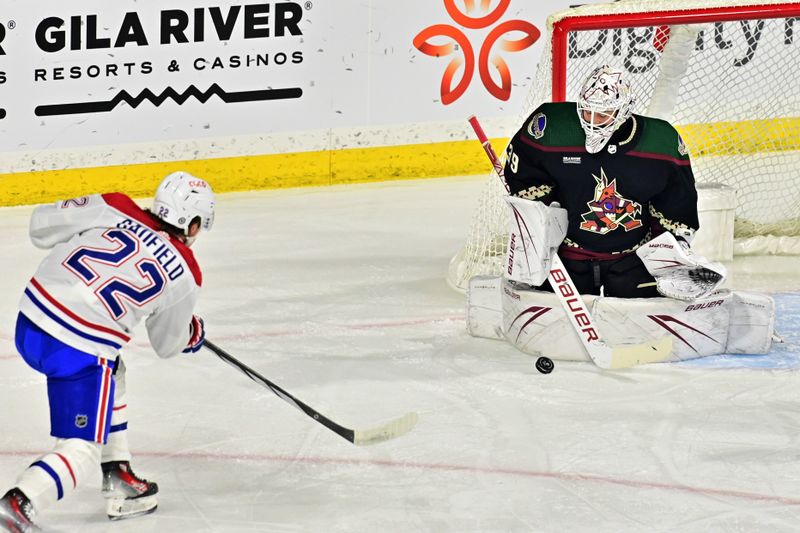 Nov 2, 2023; Tempe, Arizona, USA;  Montreal Canadiens right wing Cole Caufield (22) shoots on Arizona Coyotes goaltender Connor Ingram (39) in the first period at Mullett Arena. Mandatory Credit: Matt Kartozian-USA TODAY Sports