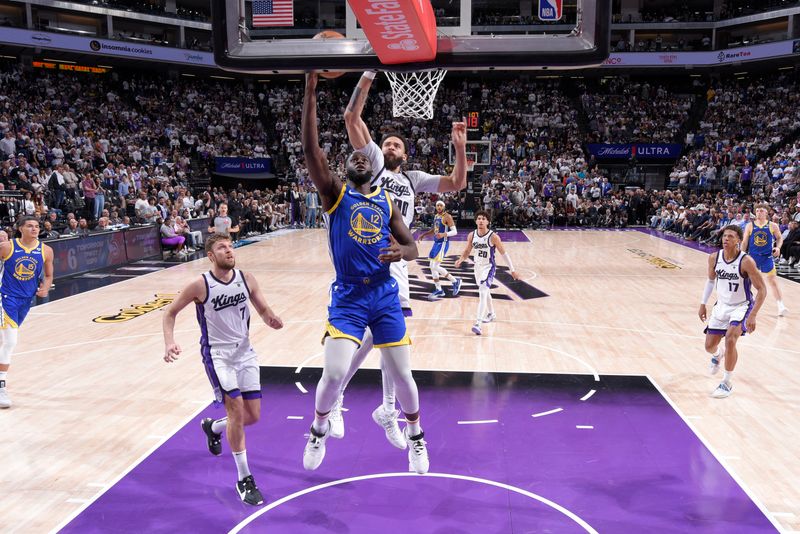 SACRAMENTO, CA - APRIL 16: Usman Garuba #12 of the Golden State Warriors drives to the basket during the game against the Sacramento Kings during the 2024 Play-In Tournament on April 16, 2024 at Golden 1 Center in Sacramento, California. NOTE TO USER: User expressly acknowledges and agrees that, by downloading and or using this Photograph, user is consenting to the terms and conditions of the Getty Images License Agreement. Mandatory Copyright Notice: Copyright 2024 NBAE (Photo by Rocky Widner/NBAE via Getty Images)