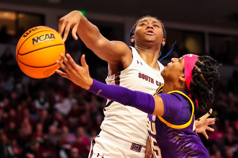 Feb 12, 2023; Columbia, South Carolina, USA; South Carolina Gamecocks forward Aliyah Boston (4) blocks the shot of LSU Lady Tigers guard Alexis Morris (45) in the second half at Colonial Life Arena. Mandatory Credit: Jeff Blake-USA TODAY Sports