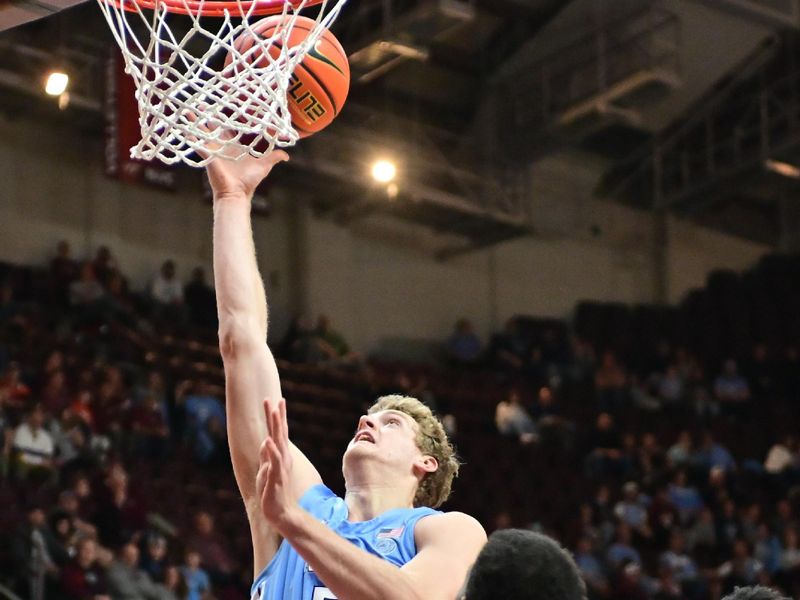 Mar 4, 2025; Blacksburg, Virginia, USA;  North Carolina Tar Heels guard Cade Tyson (5) goes up for a shot against Virginia Tech Hokies during the second half at Cassell Coliseum. Mandatory Credit: Brian Bishop-Imagn Images