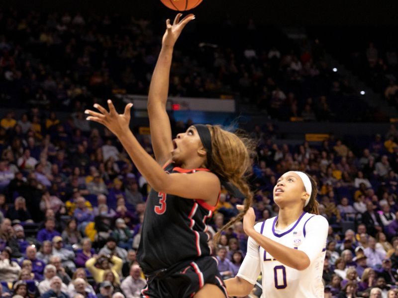 Feb 2, 2023; Baton Rouge, Louisiana, USA;  Georgia Lady Bulldogs guard Diamond Battles (3) drives to the basket against LSU Lady Tigers forward LaDazhia Williams (0) during the second half at Pete Maravich Assembly Center. Mandatory Credit: Stephen Lew-USA TODAY Sports