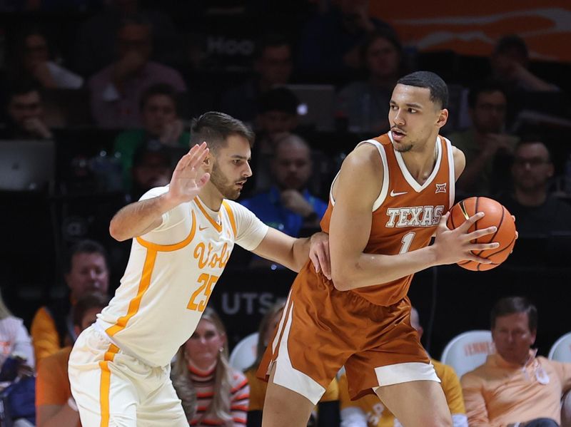 Jan 28, 2023; Knoxville, Tennessee, USA; Texas Longhorns forward Dylan Disu (1) looks to moves the ball against Tennessee Volunteers guard Santiago Vescovi (25) during the second half at Thompson-Boling Arena. Mandatory Credit: Randy Sartin-USA TODAY Sports