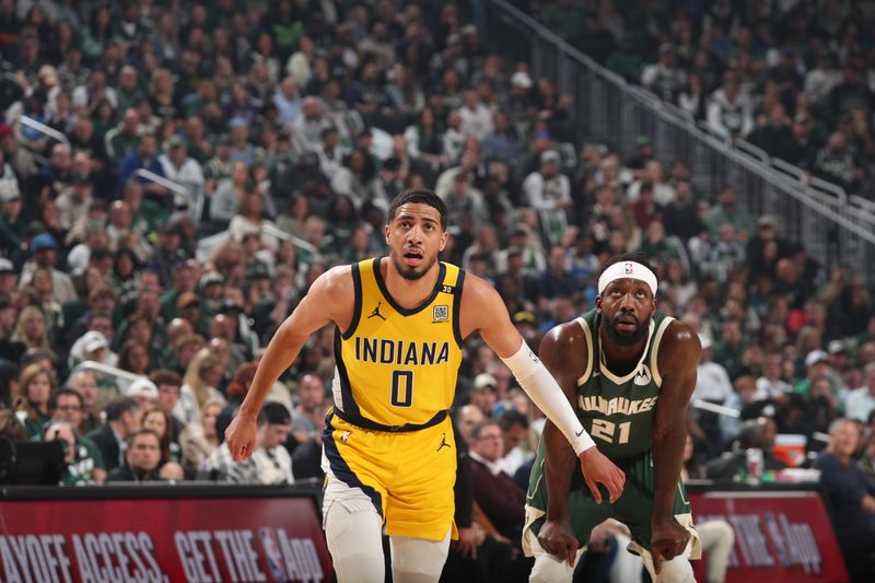 MILWAUKEE, WI - APRIL 21: Tyrese Haliburton #0 of the Indiana Pacers and Patrick Beverley #21 of the Milwaukee Bucks wait for a rebound during the game during Round 1 Game 1 of the 2024 NBA Playoffs on April 21, 2024 at the Fiserv Forum Center in Milwaukee, Wisconsin. NOTE TO USER: User expressly acknowledges and agrees that, by downloading and or using this Photograph, user is consenting to the terms and conditions of the Getty Images License Agreement. Mandatory Copyright Notice: Copyright 2024 NBAE (Photo by Gary Dineen/NBAE via Getty Images).