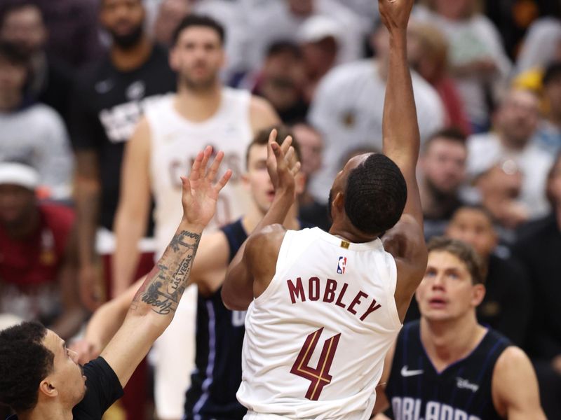 CLEVELAND, OH - APRIL 20: Evan Mobley #4 of the Cleveland Cavaliers shoots the ball during Round One Game One of the 2024 NBA Playoffs against the Orlando Magic on April 20, 2024 at Rocket Mortgage FieldHouse in Cleveland, Ohio. NOTE TO USER: User expressly acknowledges and agrees that, by downloading and/or using this Photograph, user is consenting to the terms and conditions of the Getty Images License Agreement. Mandatory Copyright Notice: Copyright 2024 NBAE (Photo by  Lauren Leigh Bacho/NBAE via Getty Images)