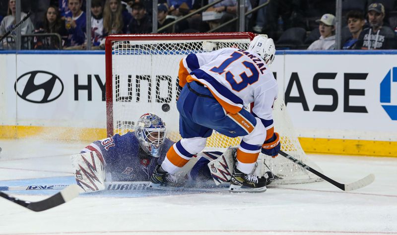 Sep 24, 2024; New York, New York, USA; New York Islanders center Mathew Barzal (13) beats New York Rangers goalie Igor Shesterkin (31) for a goal during the second period at Madison Square Garden. Mandatory Credit: Danny Wild-Imagn Images