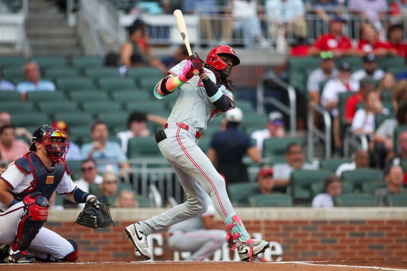 Jul 22, 2024; Atlanta, Georgia, USA; Cincinnati Reds shortstop Elly De La Cruz (44) hits a triple against the Atlanta Braves in the first inning at Truist Park. Mandatory Credit: Brett Davis-USA TODAY Sports