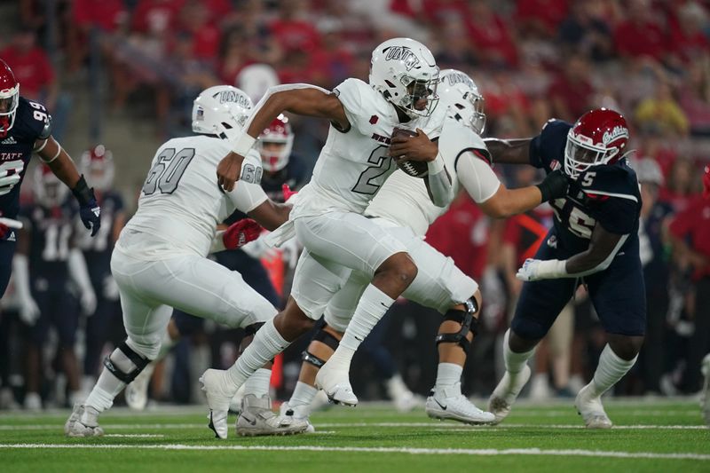 Sep 24, 2021; Fresno, California, USA; UNLV Rebels quarterback Doug Brumfield (2) runs the ball against the Fresno State Bulldogs in the first quarter at Bulldog Stadium. Mandatory Credit: Cary Edmondson-USA TODAY Sports