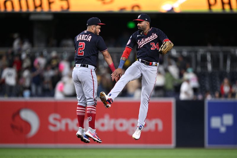 Jun 24, 2023; San Diego, California, USA; Washington Nationals second baseman Luis Garcia (2) and center fielder Derek Hill (34) celebrate on the field after defeating the San Diego Padres at Petco Park. Mandatory Credit: Orlando Ramirez-USA TODAY Sports