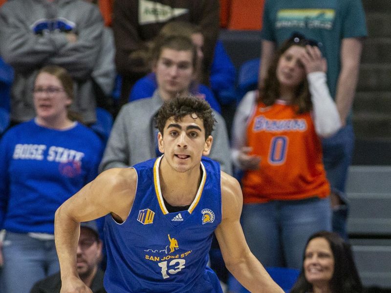 Jan 3, 2023; Boise, Idaho, USA; San Jose State Spartans guard Alvaro Cardenas (13) dribbles the ball during the first half against the Boise State Broncos at ExtraMile Arena. Mandatory Credit: Brian Losness-USA TODAY Sports