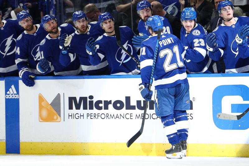 Feb 29, 2024; Tampa, Florida, USA;  Tampa Bay Lightning center Brayden Point (21) celebrates after scoring a goal against the Buffalo Sabres in the first period at Amalie Arena. Mandatory Credit: Nathan Ray Seebeck-USA TODAY Sports