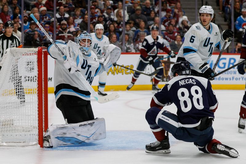 Dec 23, 2025; Denver, Colorado, USA; Utah Mammoth goaltender Vitek Vanecek (41) defects a shot as Colorado Avalanche center Martin Necas (88) looks on in the second period at Ball Arena. Mandatory Credit: Isaiah J. Downing-Imagn Images
