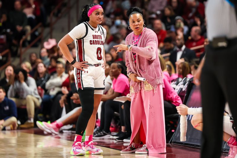 Feb 4, 2024; Columbia, South Carolina, USA; South Carolina Gamecocks head coach Dawn Staley speaks with guard Te-Hina Paopao (0) against the Ole Miss Rebels in the first half at Colonial Life Arena. Mandatory Credit: Jeff Blake-USA TODAY Sports