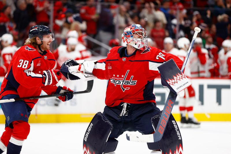 Mar 26, 2024; Washington, District of Columbia, USA; Washington Capitals goaltender Charlie Lindgren (79) celebrates with Washington Capitals defenseman Rasmus Sandin (38) after defeating the Detroit Red Wings in overtime at Capital One Arena. Mandatory Credit: Amber Searls-USA TODAY Sports