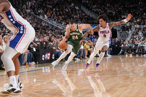 MILWAUKEE, WI - OCTOBER 26: Pat Connaughton #24 of the Milwaukee Bucks drives to the basket during the game against the Philadelphia 76ers on October 26, 2023 at the Fiserv Forum Center in Milwaukee, Wisconsin. NOTE TO USER: User expressly acknowledges and agrees that, by downloading and or using this Photograph, user is consenting to the terms and conditions of the Getty Images License Agreement. Mandatory Copyright Notice: Copyright 2023 NBAE (Photo by Jesse D. Garrabrant/NBAE via Getty Images).