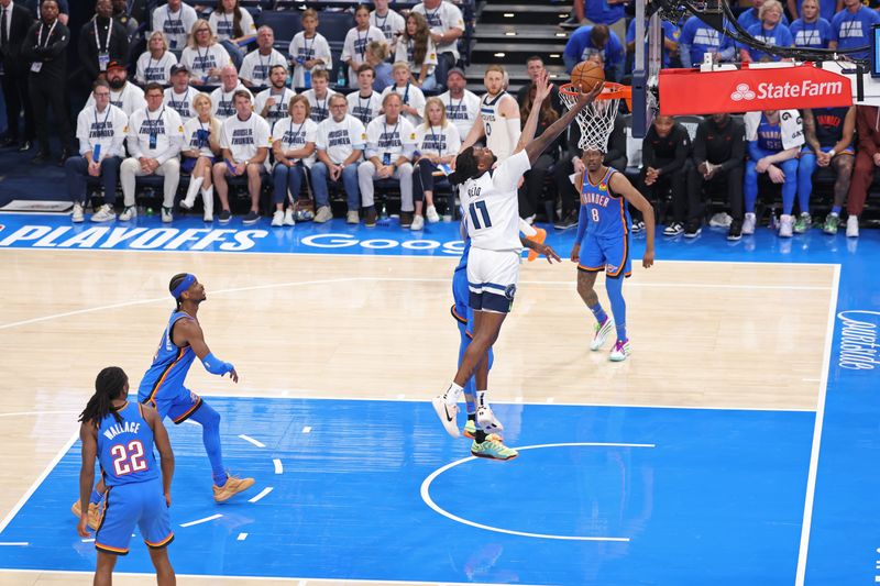 OKLAHOMA CITY, OK - MAY 28: Naz Reid #11 of the Minnesota Timberwolves drives to the basket during the game against the Oklahoma City Thunder during Game 5 of the 2025 NBA Western Conference Finals on May 28, 2025 at Paycom Center in Oklahoma City, Oklahoma. NOTE TO USER: User expressly acknowledges and agrees that, by downloading and or using this photograph, User is consenting to the terms and conditions of the Getty Images License Agreement. Mandatory Copyright Notice: Copyright 2025 NBAE (Photo by David Sherman/NBAE via Getty Images)