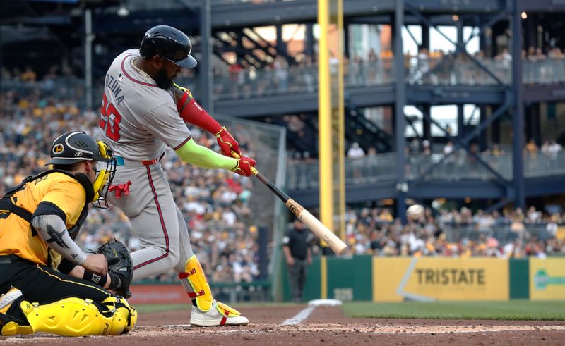 May 24, 2024; Pittsburgh, Pennsylvania, USA;  Atlanta Braves designated hitter Marcell Ozuna (20) hits a double  against the Pittsburgh Pirates during the fourth inning at PNC Park. Mandatory Credit: Charles LeClaire-USA TODAY Sports