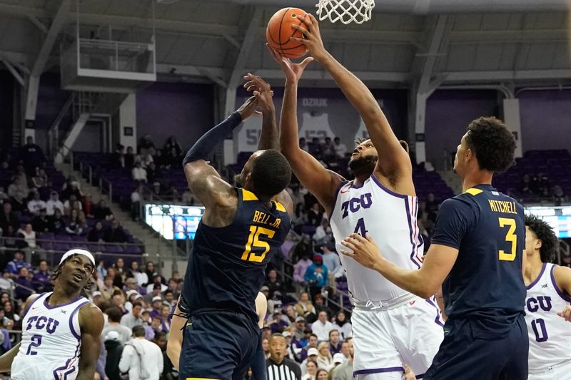 Jan 31, 2023; Fort Worth, Texas, USA; TCU Horned Frogs center Eddie Lampkin Jr. (4) grabs a reobound over West Virginia Mountaineers forward Jimmy Bell Jr. (15) during the first half at Ed and Rae Schollmaier Arena. Mandatory Credit: Chris Jones-USA TODAY Sports