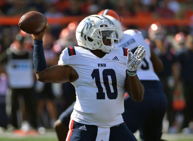 Sep 23, 2023; Champaign, Illinois, USA;  Florida Atlantic Owls quarterback Daniel Richardson (10) passes during the fist half against the Illinois Fighting Illini at Memorial Stadium. Mandatory Credit: Ron Johnson-USA TODAY Sports