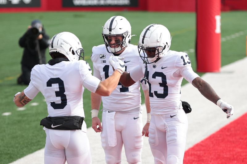 Dec 5, 2020; Piscataway, New Jersey, USA; Penn State wide receiver Parker Washington (3) celebrates his touchdown with wide receiver KeAndre Lambert-Smith (13) and quarterback Sean Clifford (14) during the first half against the Rutgers Scarlet Knights at SHI Stadium. Mandatory Credit: Vincent Carchietta-USA TODAY Sports